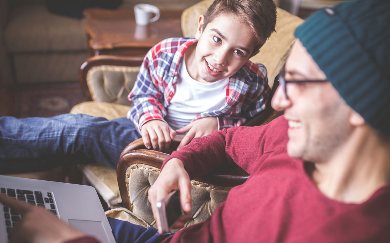 A father and son laughing together.